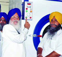 SGPC chief Avtar Singh Makkar inaugurates a laundry unit at Mata Ganga Jee Niwas on Tuesday. 