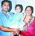 The accused with his wife and daughter in happier days