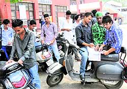 Students filling in admission forms for class XI second counselling at Government Model Senior Secondary School at Sector 10 in Chandigarh on Tuesday
