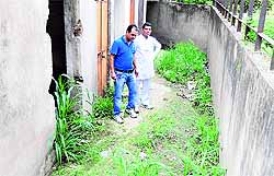 Residents show their parking area at the Modern Housing Complex in Chandigarh on Tuesday