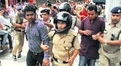 The police arrests activists of the NSUI and the ABVP in Dehradun on Tuesday. Tribune photo: Vinod Pundir