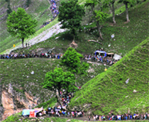 Devotees on their way to the Amarnath cave shrine on Tuesday. The annual yatra to the12,800-foot- high shrine is undertaken by lakhs of pilgrims. Photo: Amin War