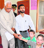 Governor NN Vohra greets differently abled children in Srinagar on Tuesday. A Tribune photograph