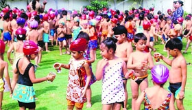 Students participate in water activity fun organised by Bal Bharati Public School in Ludhiana on Tuesday.