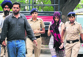 The accused Vajinder and Renu being produced in the district courts in Sector 17, Chandigarh, on Wednesday. 