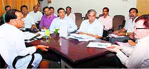 Irrigation and Revenue Minister Yashpal Arya (left) during a meeting on the Jamarani Dam issue in Dehradun on Wednesday