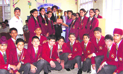 DPS Director GS Dhillon receives the best school trophy in rifle shooting in Dalhousie.