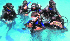 Children during a scuba-diving demonstration at Bishop Cotton School on Wednesday. Photo: Amit Kanwar