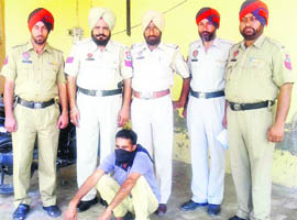 A proclaimed offender in police custody at Jagraon. 