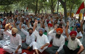 Members of the Technical Services Union (TSU) staged a dharna outside the Guru Nanak Dev Thermal Power Plant in Bathinda on Thursday
