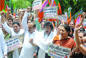 BJP leaders Vijender Gupta, Arti Mehra and Smriti Irani with women members of the party protest outside the NCW office in New Delhi on Thursday. 