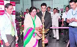 Uttarakhand Tourism Minister Amrita Rawat lights a traditional lamp at a function to mark the inauguration of the SpiceJet flights to Dehradun on Thursday