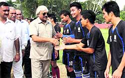 Sports and Planning Minister Dinesh Aggarwal being introduced to players at the inaugural ceremony of the 3rd ONGC BS Negi Memorial Football Tournament being played at Ambedkar Stadium in Dehradun on Thursday