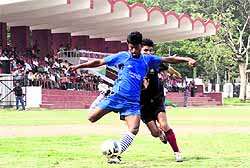 A match in the 3rd ONGC BS Negi Memorial Football Tournament in progress at Ambedkar Stadium at ONGC in Dehradun on Thursday