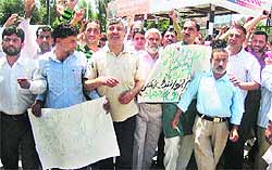 Members of the Urban Local Bodies Employees United Forum protest against the state government over their long-pending demands in Srinagar on Thursday