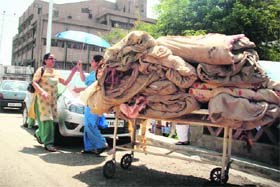 Used bedsheets and blankets being taken away for burning on the GMCH premises, Jammu, on Thursday