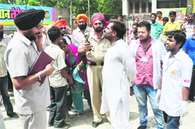 Police officials take details following the accident in Ludhiana on Thursday