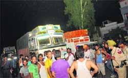 Kharar residents block the highway to Chandigarh. Tribune photo: Vicky Gharu