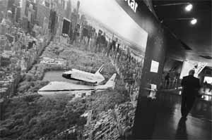 A photograph of the Space Shuttle Enterprise being transported is seen during a press preview of the Intrepid Sea, Air and Space Museums Space Shuttle Pavilion in