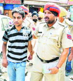 The accused in the police custody in Amritsar on Friday.