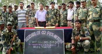 BSF officials along with the two packets of heroin recovered in the Fazilka sector on Friday. 