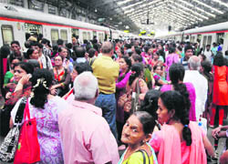 Harried passengers at a Mumbai railway station on Friday. 