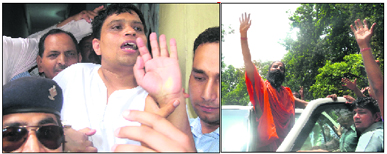Balkrishna comes out of the CBI court in Dehradun after his bail application was rejected on Saturday; and (right) yoga guru Ramdev along with his supporters on the Dehradun-Haridwar highway.