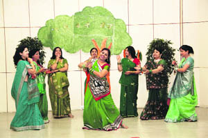 Members of the Ladies Club of the FRI give a performance as part of Teej celebrations. 