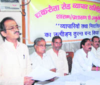 Chakrata Road shopkeepers address a press conference to highlight their gievances in Dehradun on Saturday.
