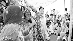 A woman shouts slogans during a dharna by farmers at Gorakhpur village in Fatehabad. A Tribune photograph