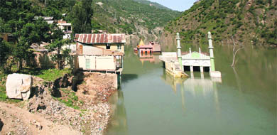 The partially submerged temple and mosque in Pul Doda town.