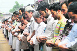 People offer prayers on the first day of the holy month of Ramadan in Srinagar on Saturday.
