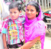 Pintu with his mother in Ludhiana on Saturday.