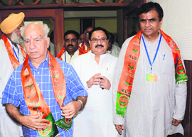 BJP leaders Shanta Kumar (L), JP Nadda and OP Dhankar (R) in Chandigarh on Saturday.