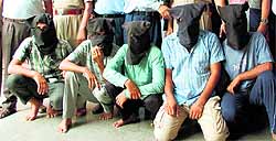 Persons (with covered faces) belonging to two gangs of thieves in the police custody in Amritsar on Sunday