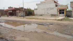 A road near the grain market in Ferozepur has got damaged within a few days of its construction