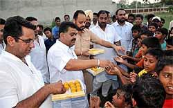 Congress workers distribute sweets following Pranab Mukherjees election as the President of the country, in Bathinda on Sunday