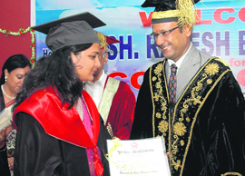 A student receives her degree at the PKR Jain College of Education, Ambala.