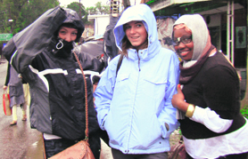 Foreigners enjoy rain in Kangra on Sunday. 
