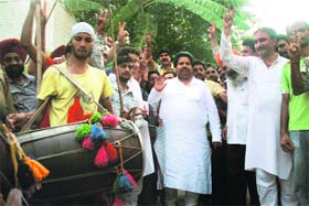 Congress supporters celebrate the victory of UPA candidate Pranab Mukherjee in the Presidential elections, in Jammu on Sunday
