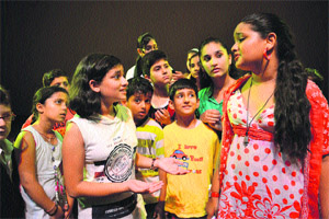 Artistes enact a scene from the play Dil to Bachha Hai at Police Auditorium in Jammu on Sunday.