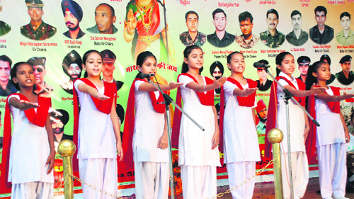 Students sing a group song to commemorate Kargil Diwas