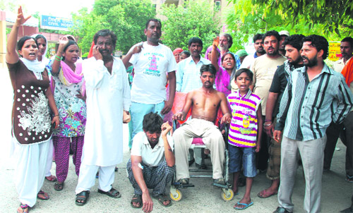 Relatives of two injured persons, who have been admitted to the Civil Hospital, protest against the authorities in Jalandhar on Sunday saying they were not taking proper care of the patients. 