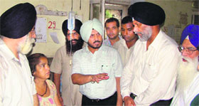 Rural Development and Panchayats Minister Surjit Singh Rakhra enquires about health of a patient in Patiala on Sunday.