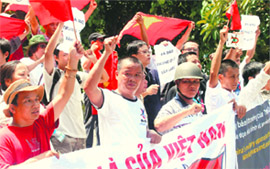 Protesters chant slogans at an anti-China rally in Hanoi on Sunday.