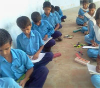 School children take part in a painting competition at the government secondary school, Maisarkhana
