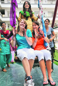 Students from Belgium celebrate teej with their friends at the Chandigarh Group of College at Landran in Mohali on Monday.