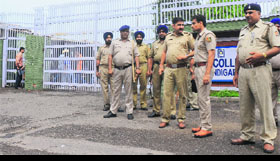 Policemen deployed outside the gate of the DAV College, Sector 10, following the recent incidents of violence on the campus, on Monday.