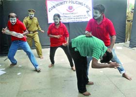 Artistes perform a drama against ragging organised by the Delhi police at the Delhi University Metro station