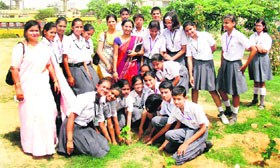 Students of Greenwood Public School plant saplings at a park behind Sikandarpur Power House under the Green Gurgaon Campaign in Gurgaon.